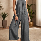 Solmira | Lahtine denim üleõlgadega jumpsuit
